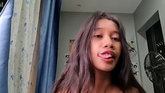A Small Asian Woman With A Petite Figure